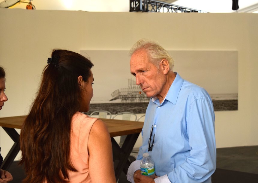 Theo Jansen conversing with patrons of the Strandbeest Audemars Piguet pavilion at Art Basel, 2014