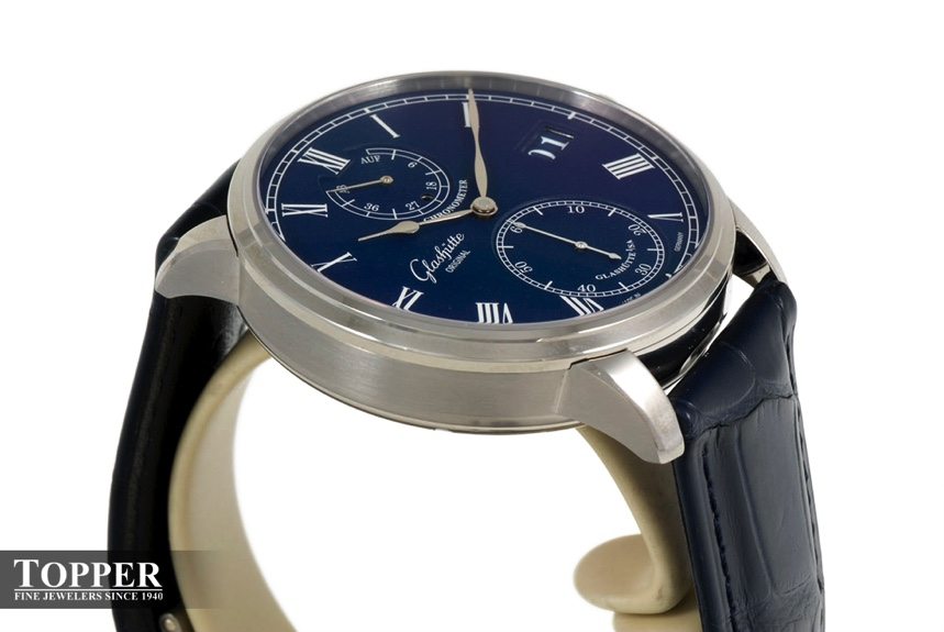 A side view of the 42mm brushed finish 18ct white gold case on dial coordinated blue Louisiana Alligator leather strap.