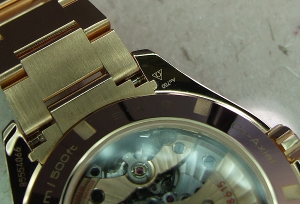 Gold hallmark on lug of Aqua Terra GMT